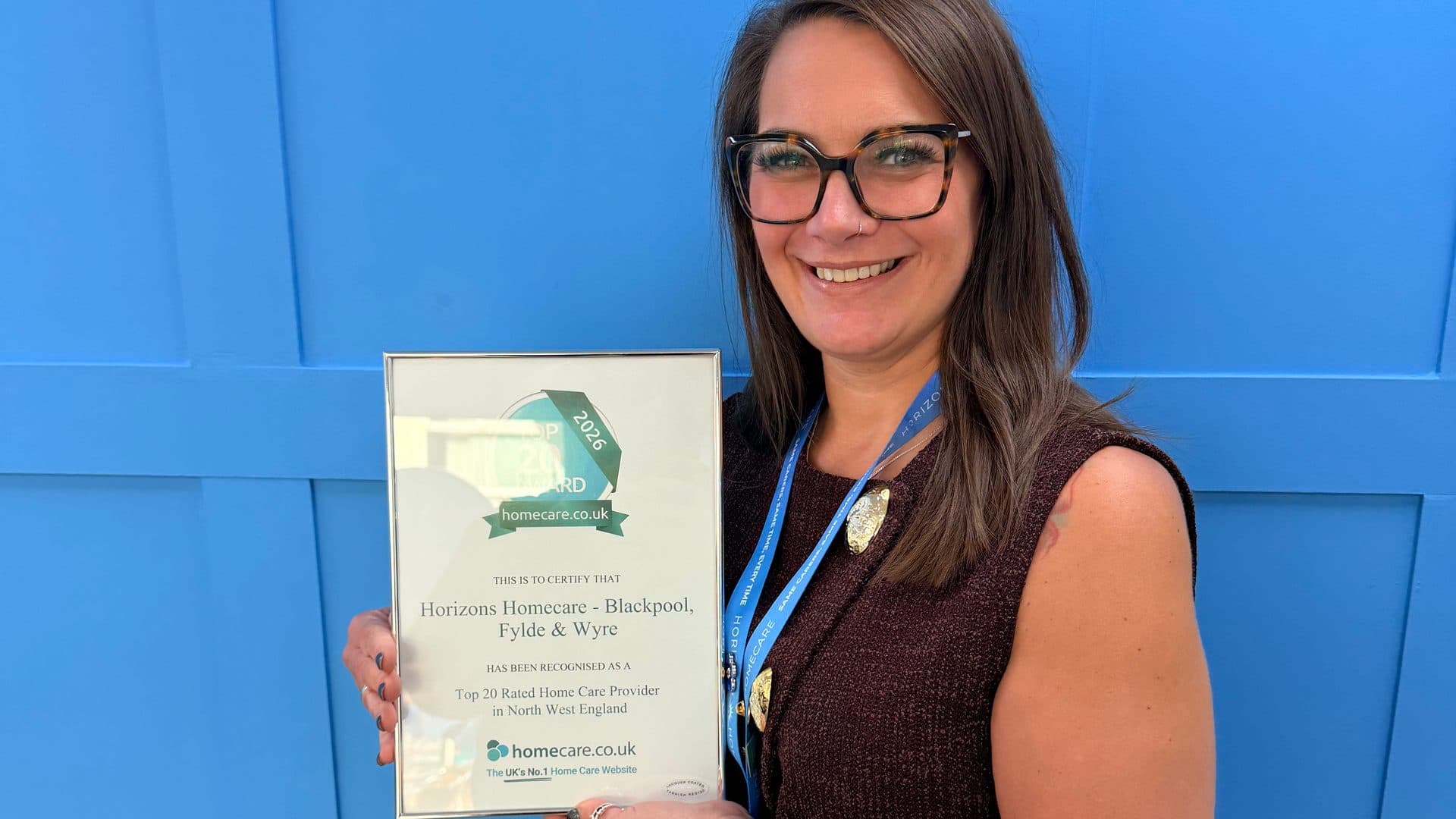 Lisa Garrad, Registered Manager, Blackpool, holding the homecare.co.uk Top 20 2026 certificate for Horizons Homecare Blackpool, Fylde & Wyre
